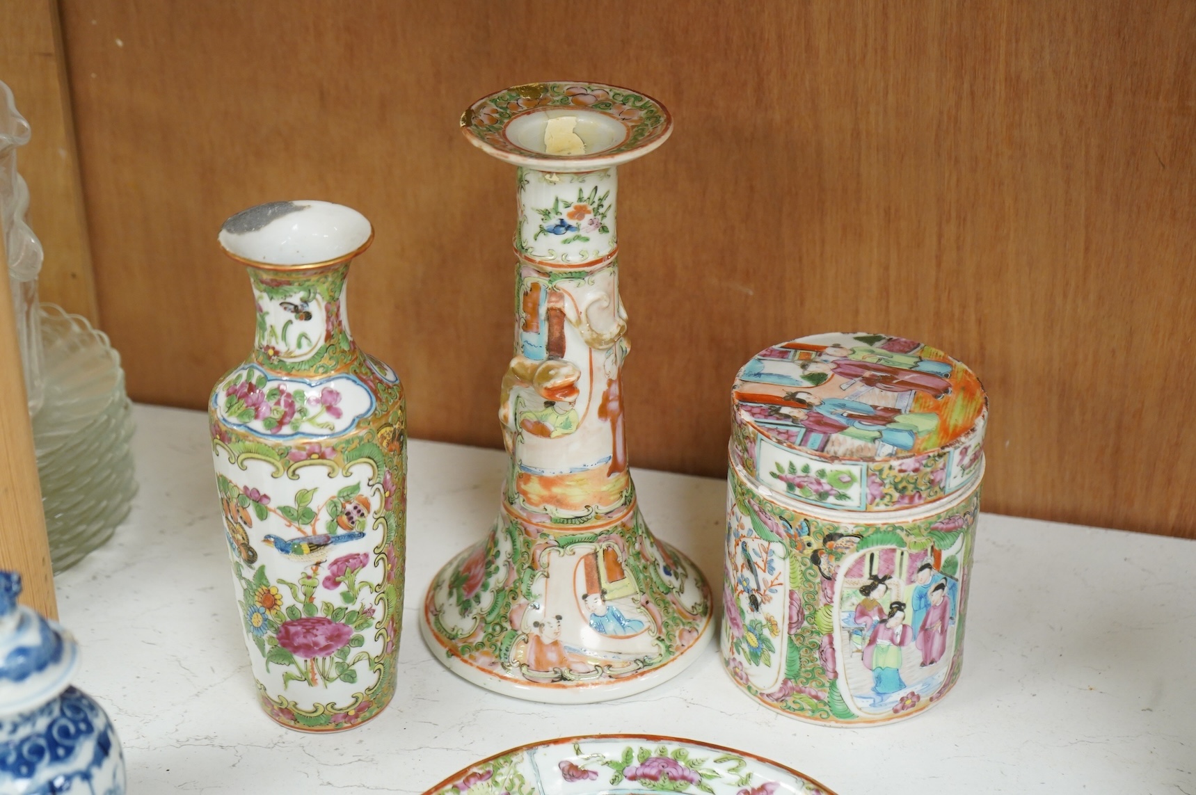 A collection of 19th century Chinese porcelain to include a pair of famille rose candlesticks, dish and a pair of blue and white baluster vases and covers